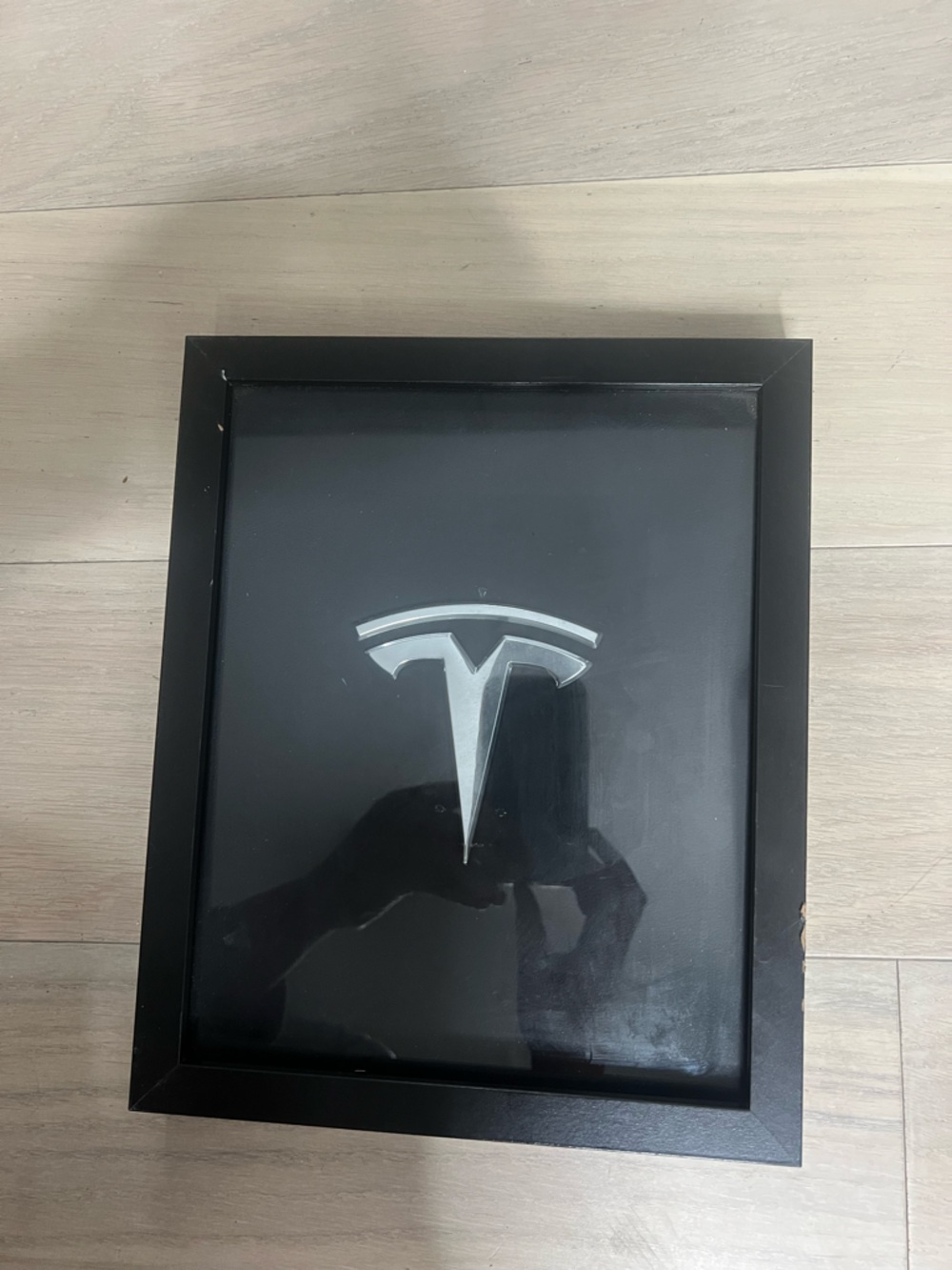 Tesla Silver Emblem Framed Art on Black